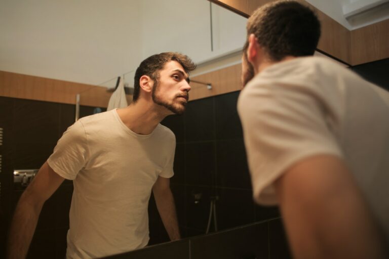 Application of castor oil on the beard