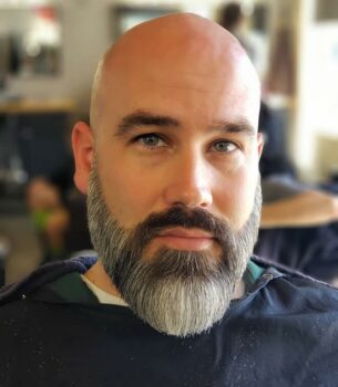 Ducktail beard on a man with a bald head