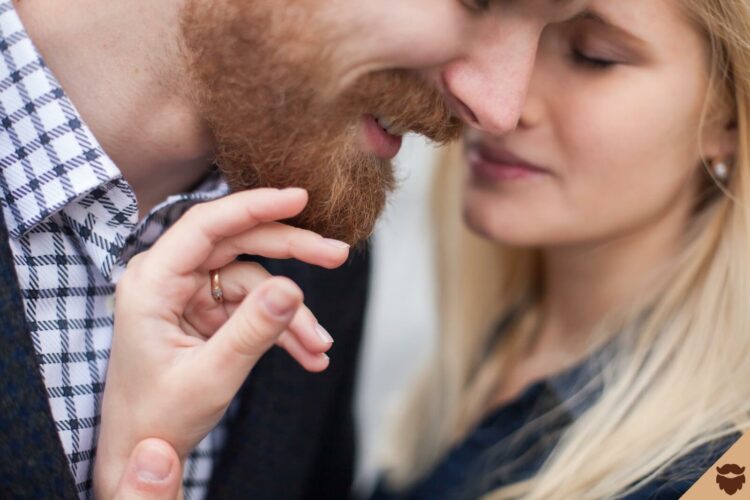 Woman touching the man's beard