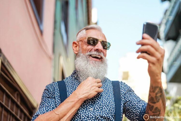 Bearded man takes a picture of himself
