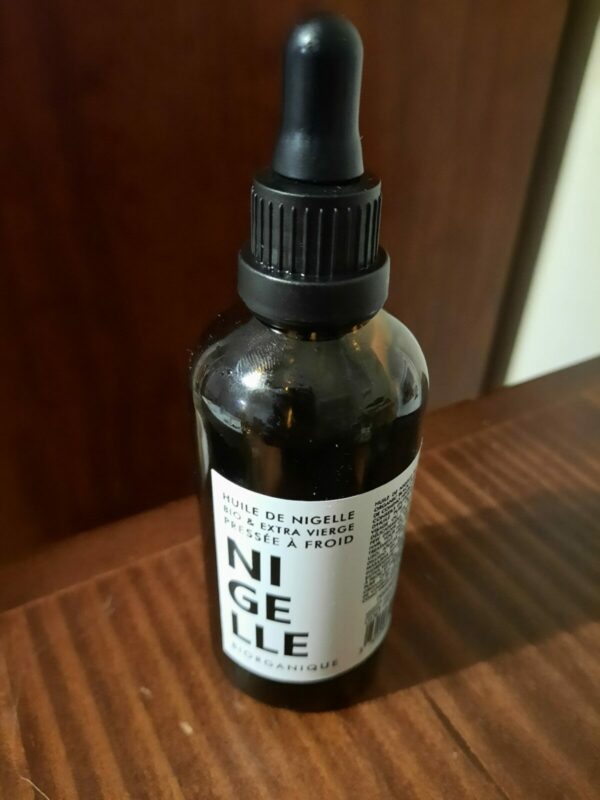 Bottle of black cumin oil for beard biorganic
